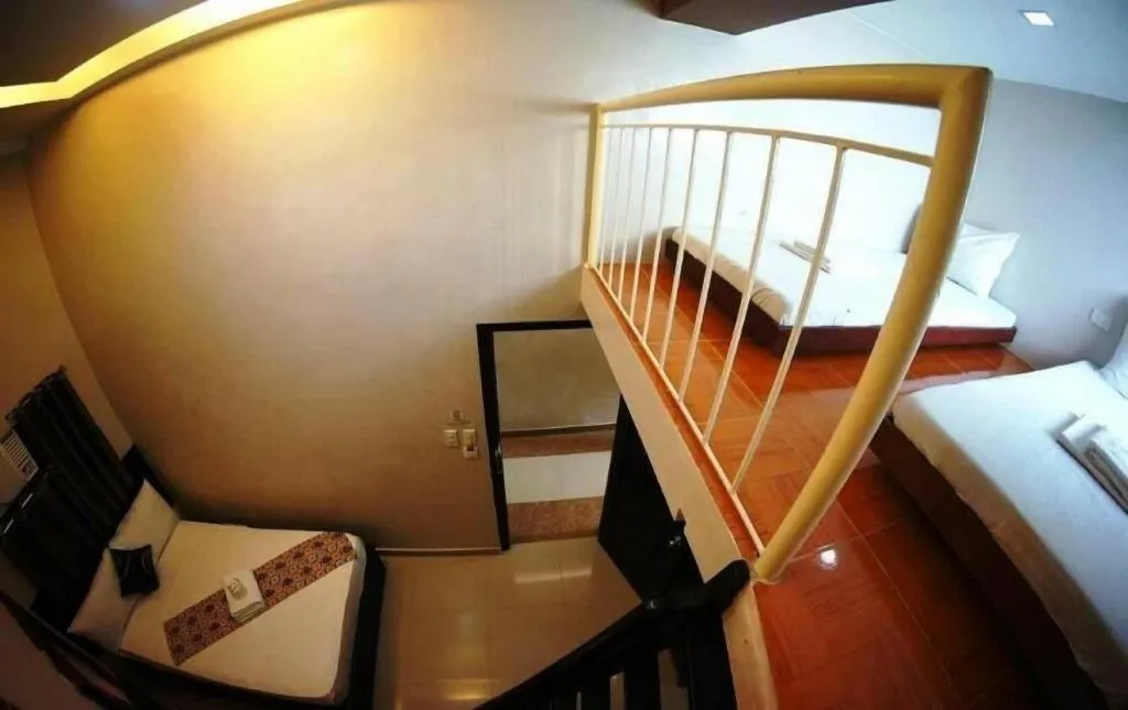 Bed in Rovic's Tourist Hotel