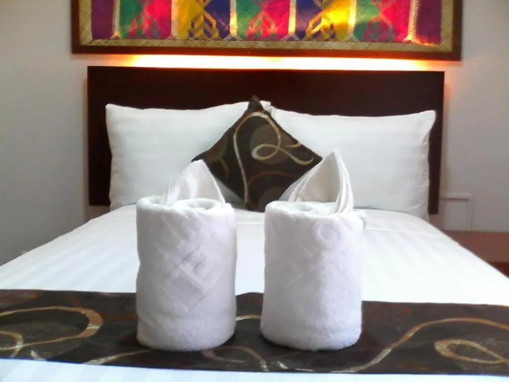 Bed in Rovic's Tourist Hotel