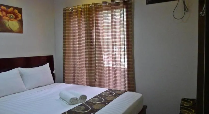 Bed in Rovic's Tourist Hotel