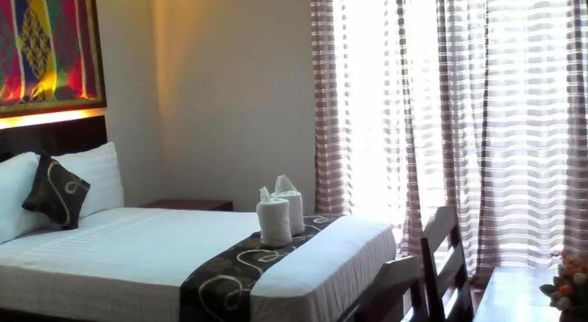 Bed in Rovic's Tourist Hotel