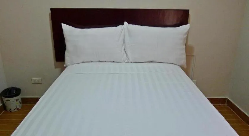 Bed in Rovic's Tourist Hotel