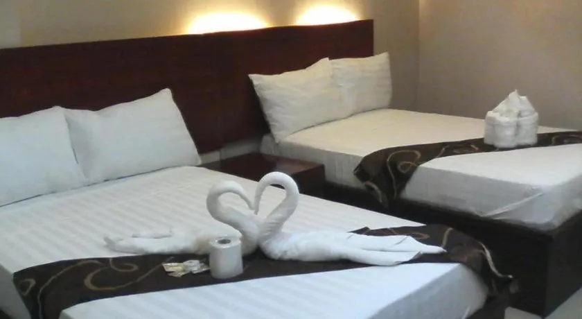 Bed in Rovic's Tourist Hotel