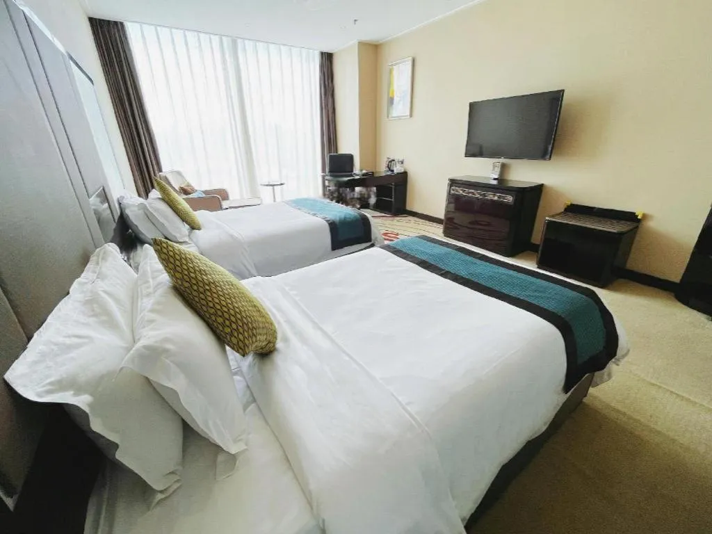 Bed in Pacific Regency Hotel Shenyang