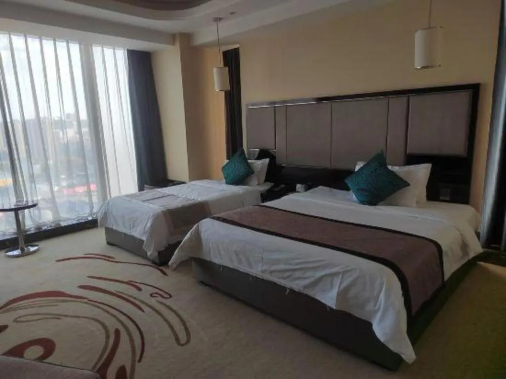 Bed in Pacific Regency Hotel Shenyang