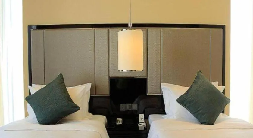 Bed in Pacific Regency Hotel Shenyang