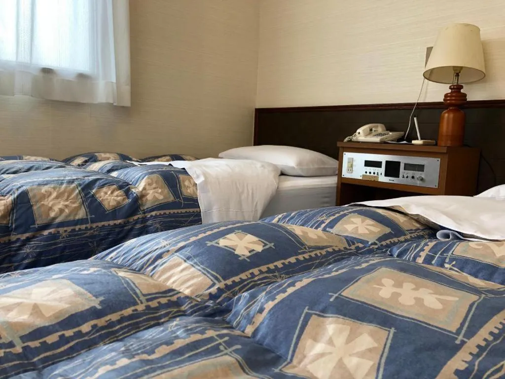 Bed in Hotel Town Nishikigawa