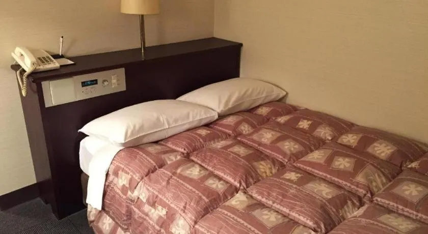 Bed in Hotel Town Nishikigawa