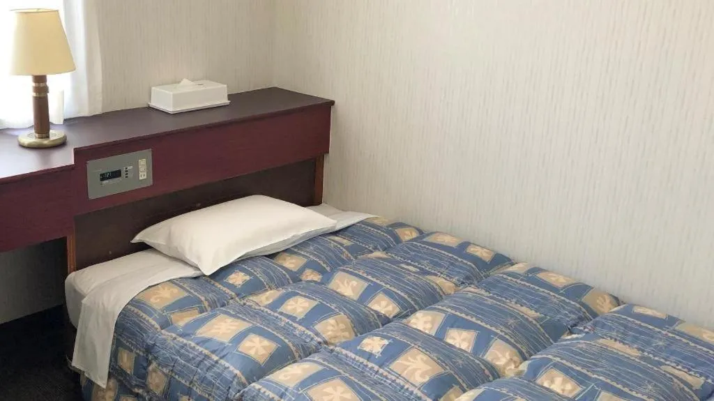 Bed in Hotel Town Nishikigawa