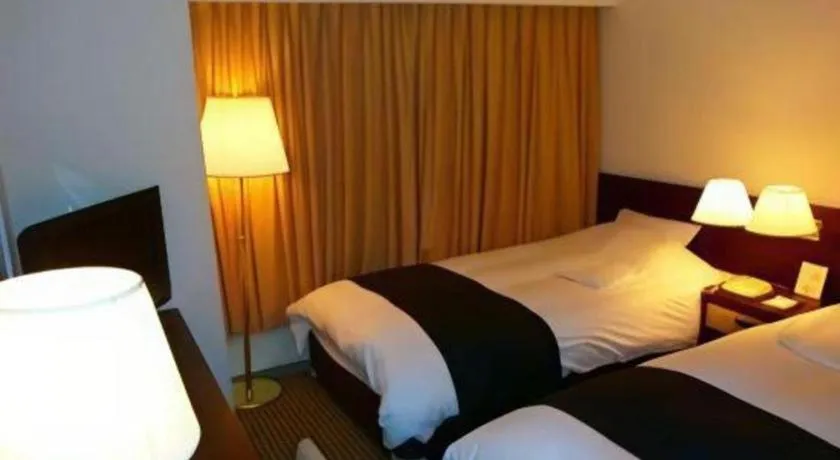 Bed in Welcome Hotel Kochi