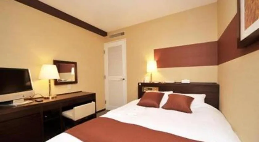 Bed in Welcome Hotel Kochi