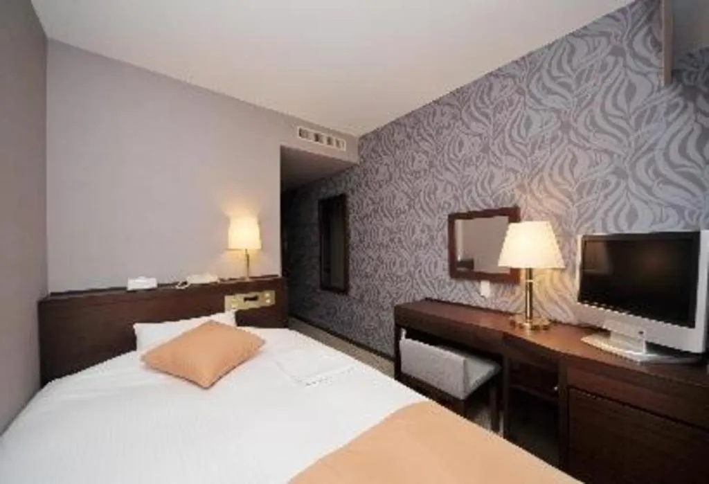 Bed in Welcome Hotel Kochi