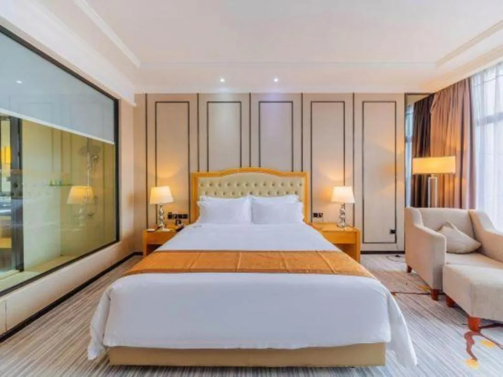 Bed in Golden Phoenix International Hotel