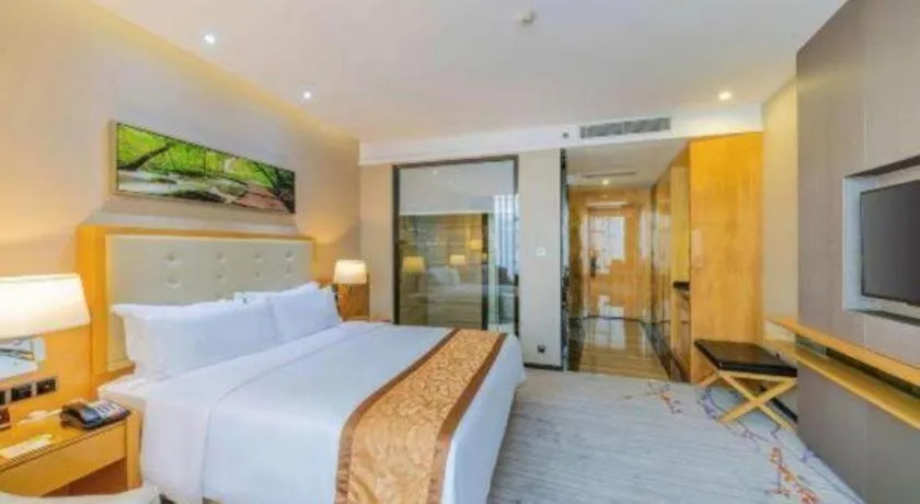 Bed in Golden Phoenix International Hotel