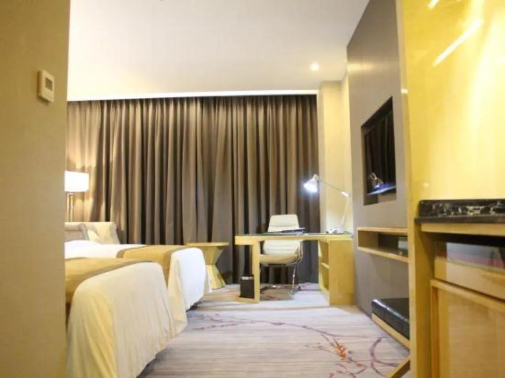 Bed in Golden Phoenix International Hotel