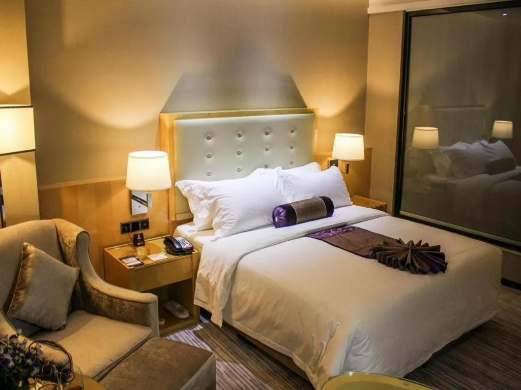 Bed in Golden Phoenix International Hotel