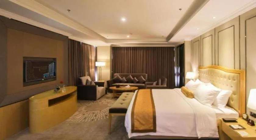 Bed in Golden Phoenix International Hotel