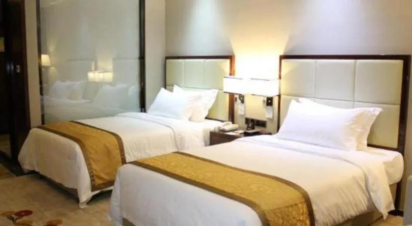 Bed in Golden Phoenix International Hotel