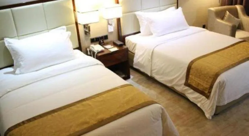 Bed in Golden Phoenix International Hotel