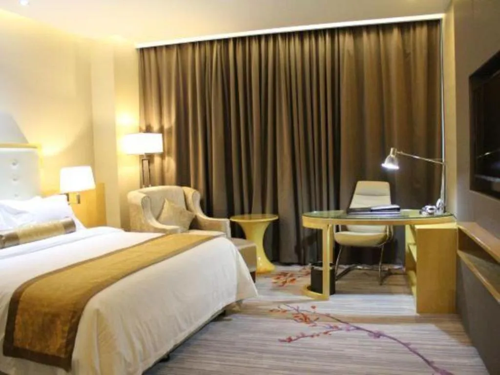 Bed in Golden Phoenix International Hotel