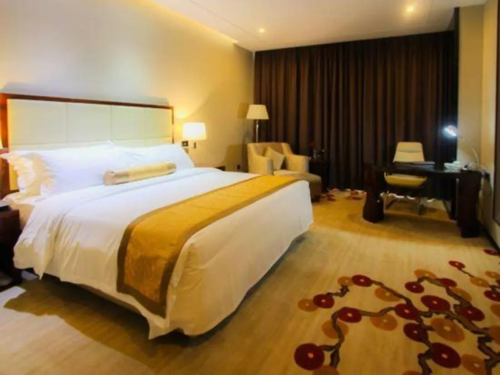 Bed in Golden Phoenix International Hotel