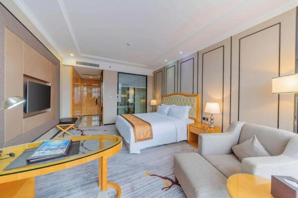 Bed in Golden Phoenix International Hotel