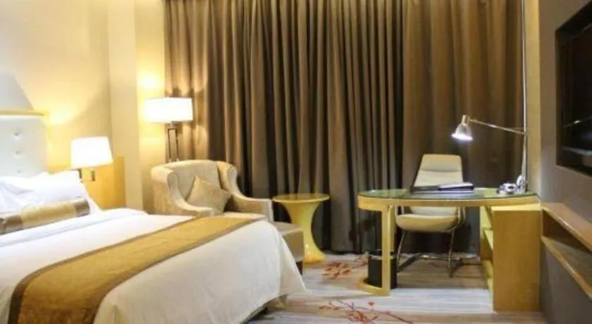 Bed in Golden Phoenix International Hotel