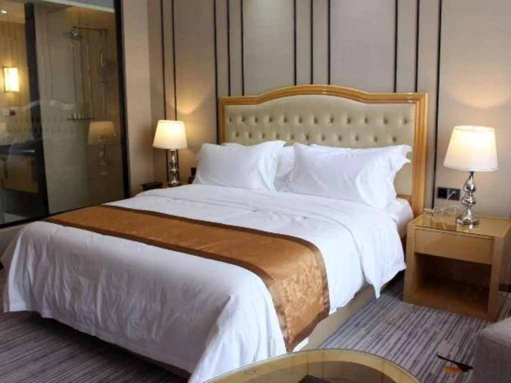 Bed in Golden Phoenix International Hotel