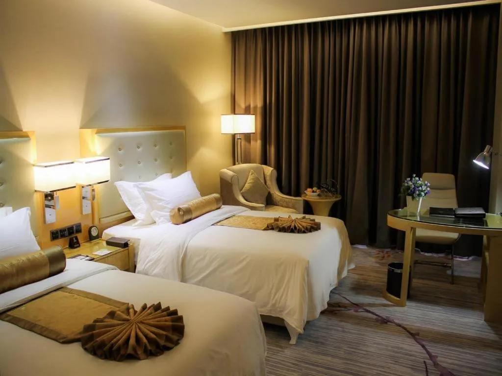 Bed in Golden Phoenix International Hotel