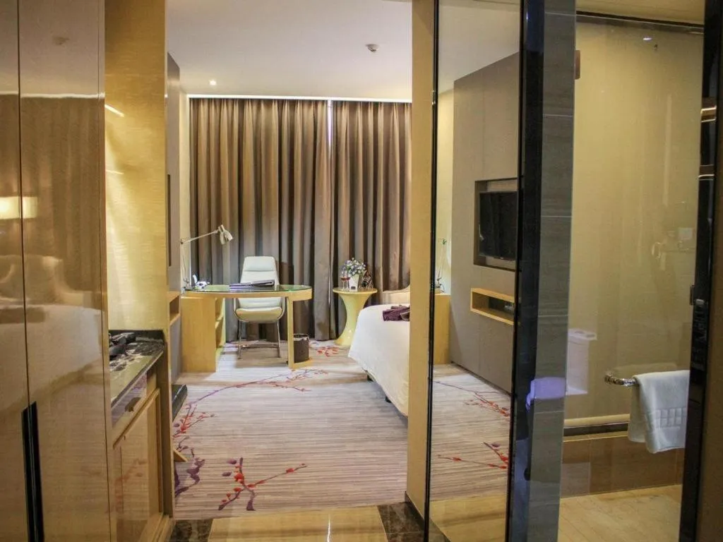 Bed in Golden Phoenix International Hotel