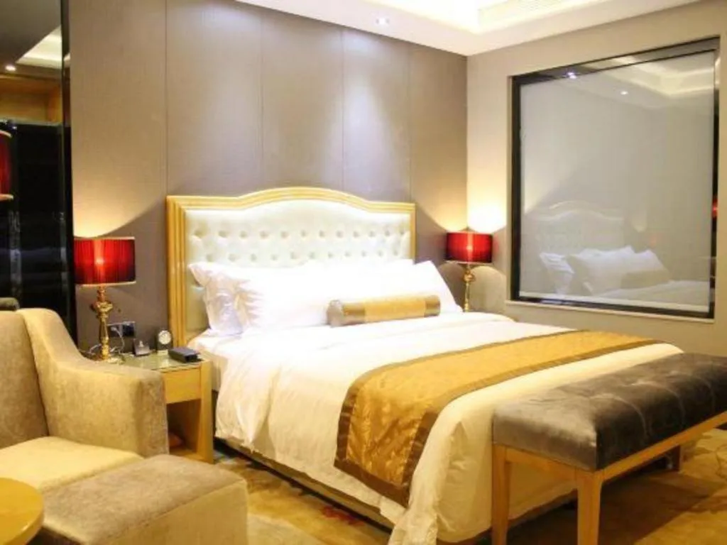 Bed in Golden Phoenix International Hotel