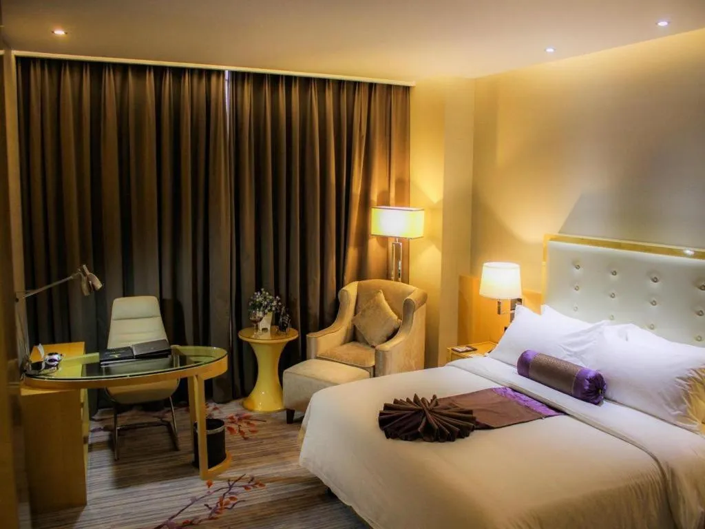 Bed in Golden Phoenix International Hotel