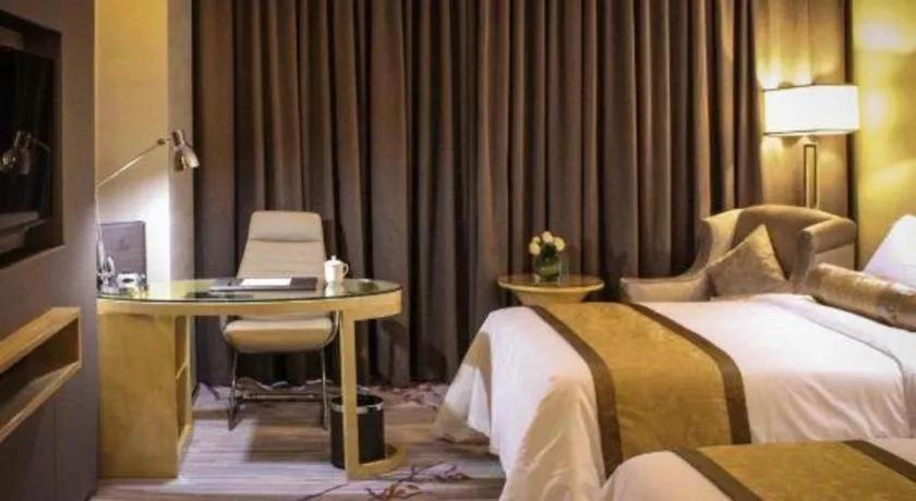 Bed in Golden Phoenix International Hotel