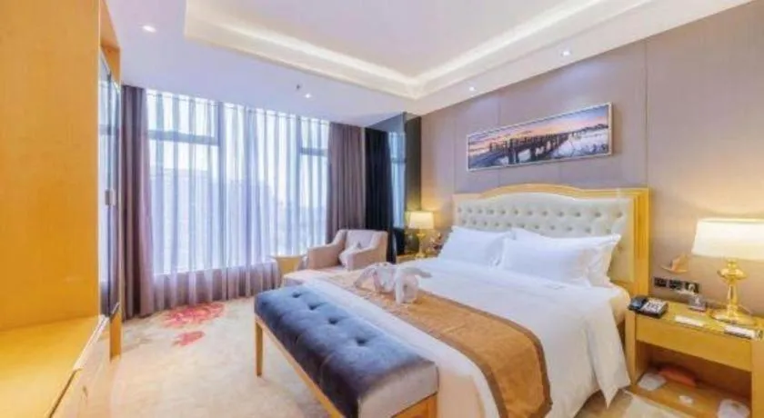 Bed in Golden Phoenix International Hotel