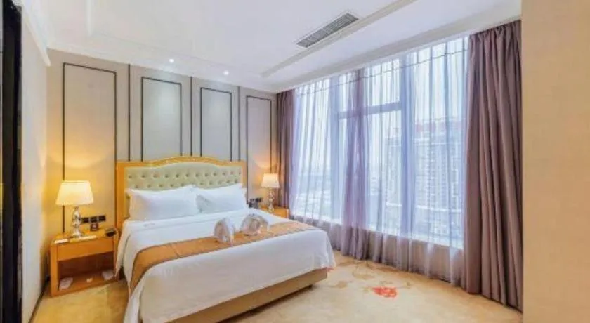 Bed in Golden Phoenix International Hotel