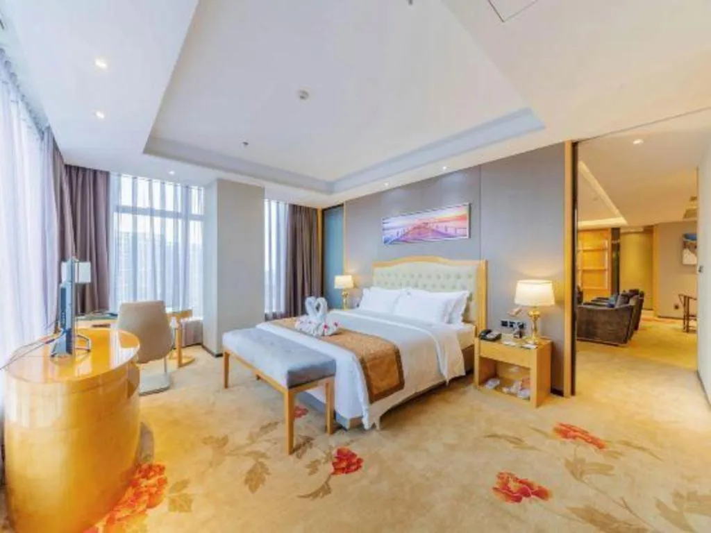 Bed in Golden Phoenix International Hotel