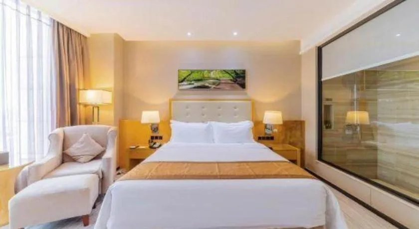 Bed in Golden Phoenix International Hotel