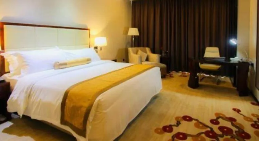 Bed in Golden Phoenix International Hotel