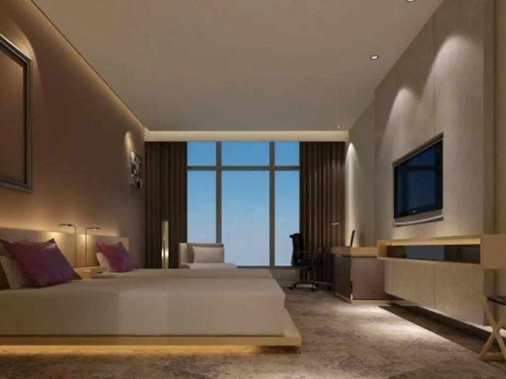 Bed in Golden Phoenix International Hotel