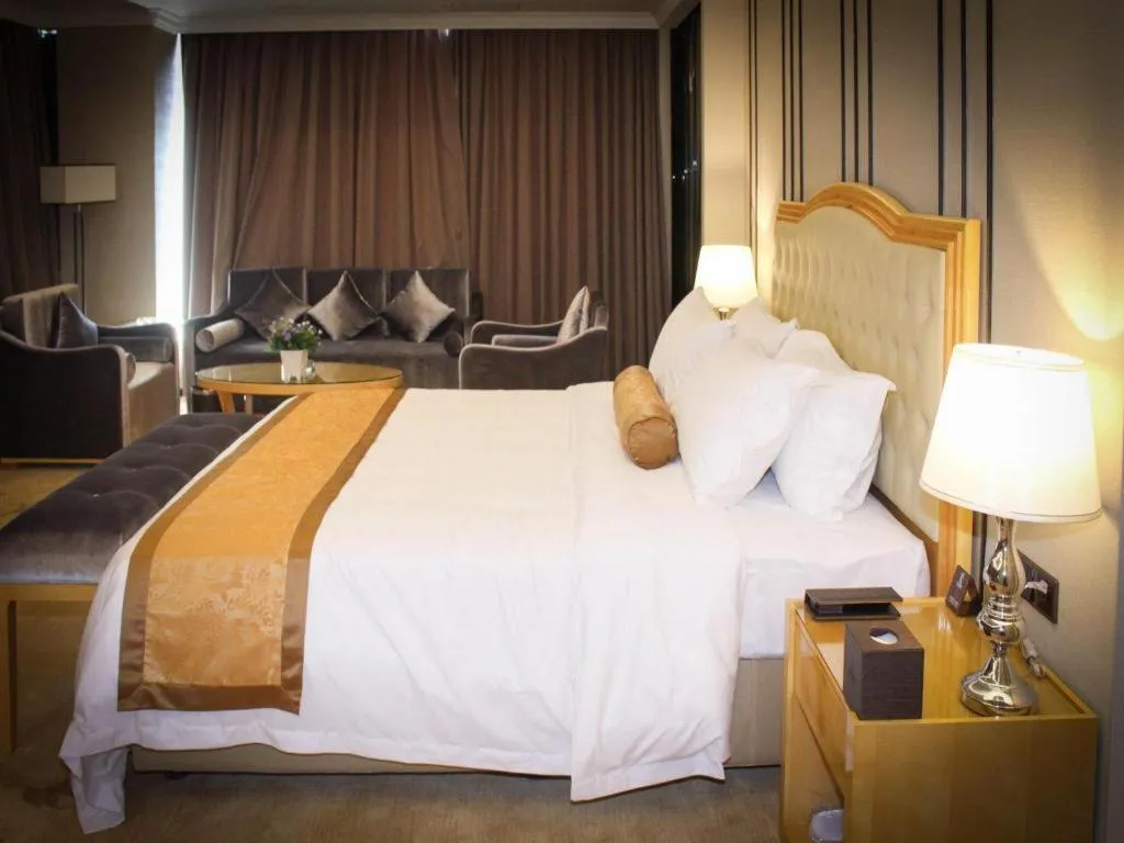 Bed in Golden Phoenix International Hotel