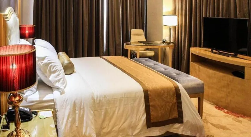 Bed in Golden Phoenix International Hotel