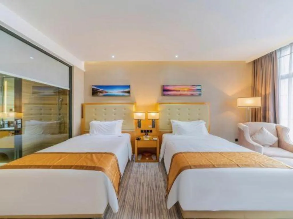 Bed in Golden Phoenix International Hotel