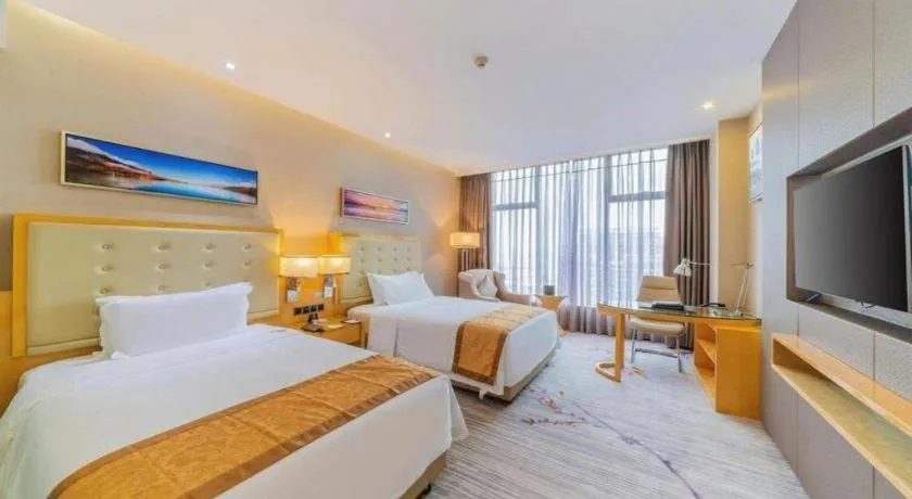 Bed in Golden Phoenix International Hotel