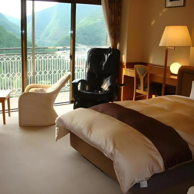 Bed in Hotel Hikyounoyu