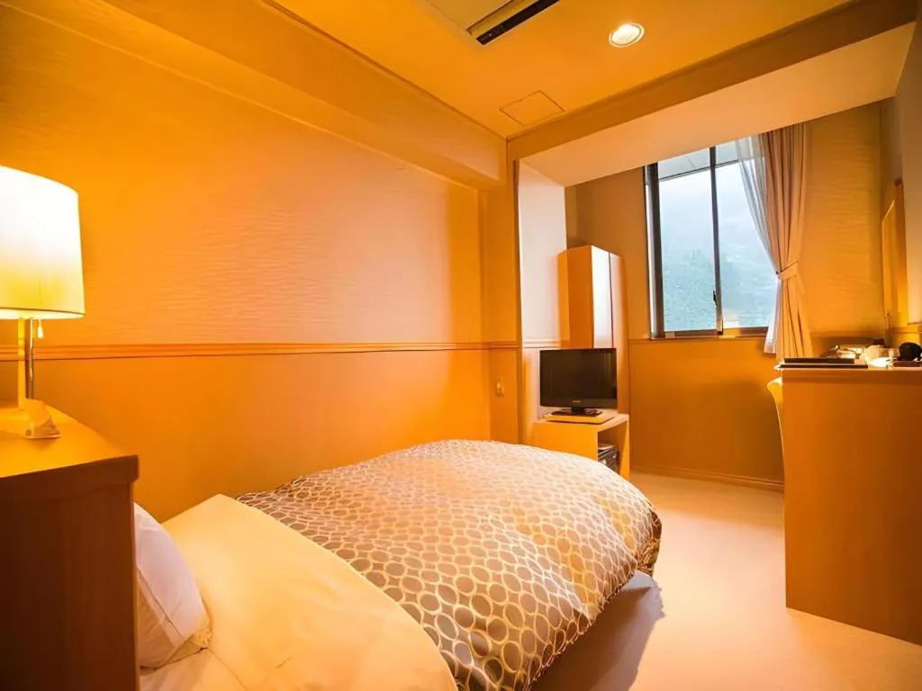 Bed in Hotel Hikyounoyu