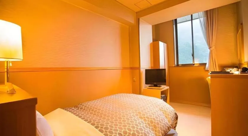 Bed in Hotel Hikyounoyu