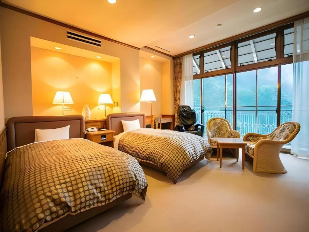 Bed in Hotel Hikyounoyu