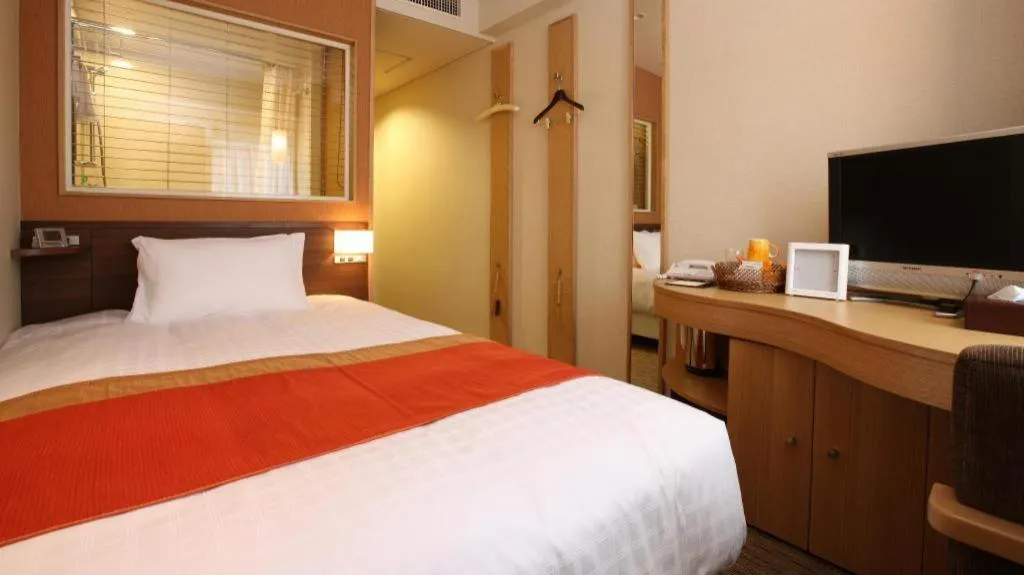 Bed in Ochanomizu Hotel Juraku