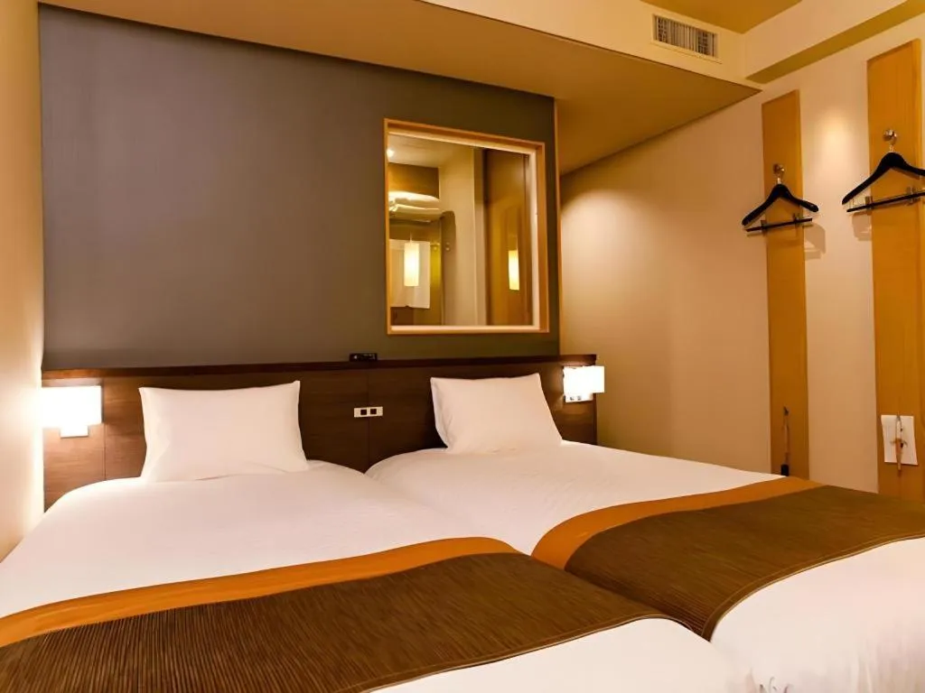 Bed in Ochanomizu Hotel Juraku