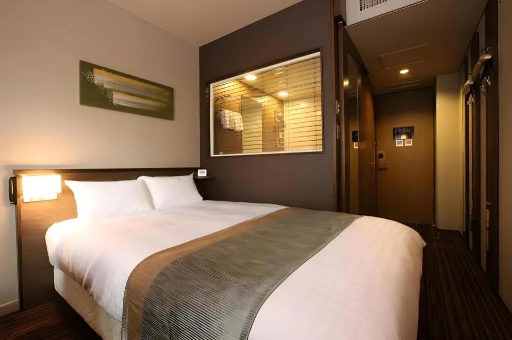 Bed in Ochanomizu Hotel Juraku