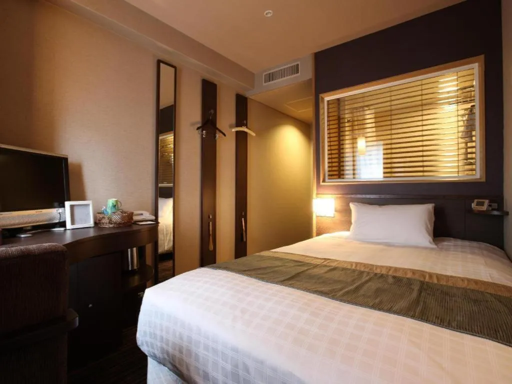 Bed in Ochanomizu Hotel Juraku